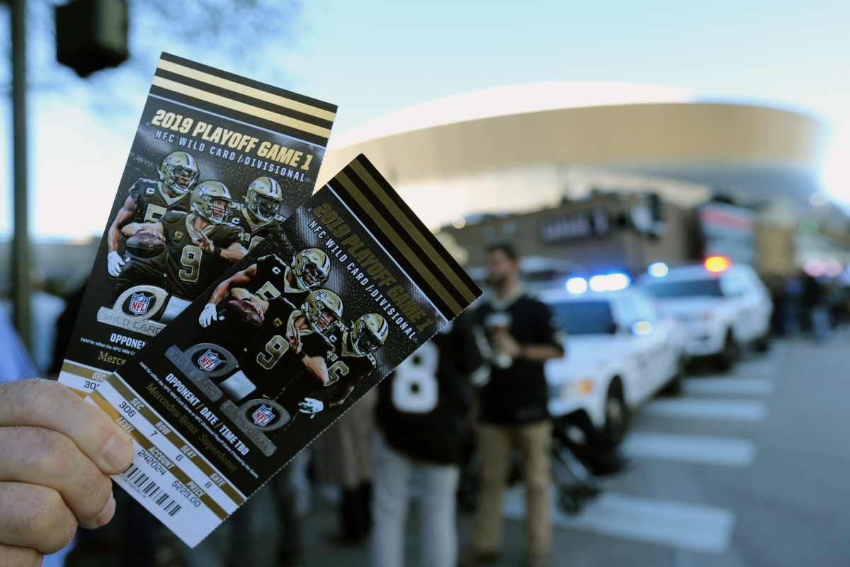 Jan 5, 2020; New Orleans, Louisiana, USA; A fan holds tickets outside the Mercedes-Benz Superdome before an NFC Wild Card playoff football game between the New Orleans Saints and the Minnesota Vikings. Mandatory Credit: Chuck Cook -USA TODAY Sports
